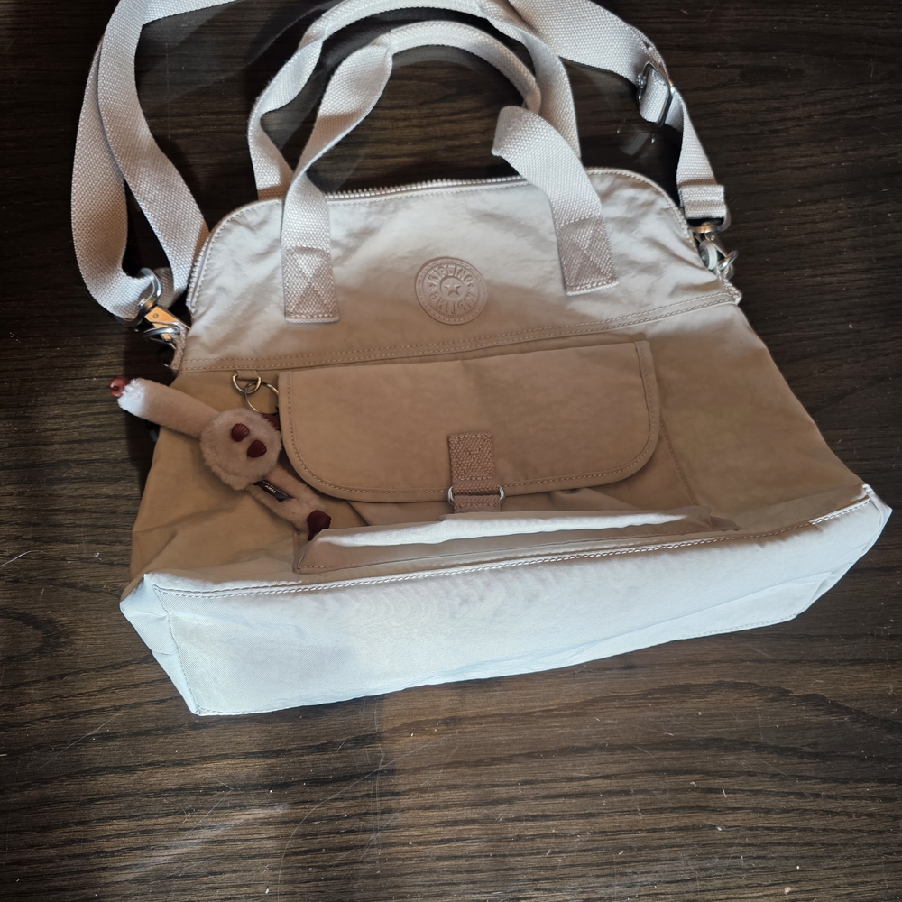 Kipling Women's Pahneiro Handbag in the color Light Cream With Monkey Charm